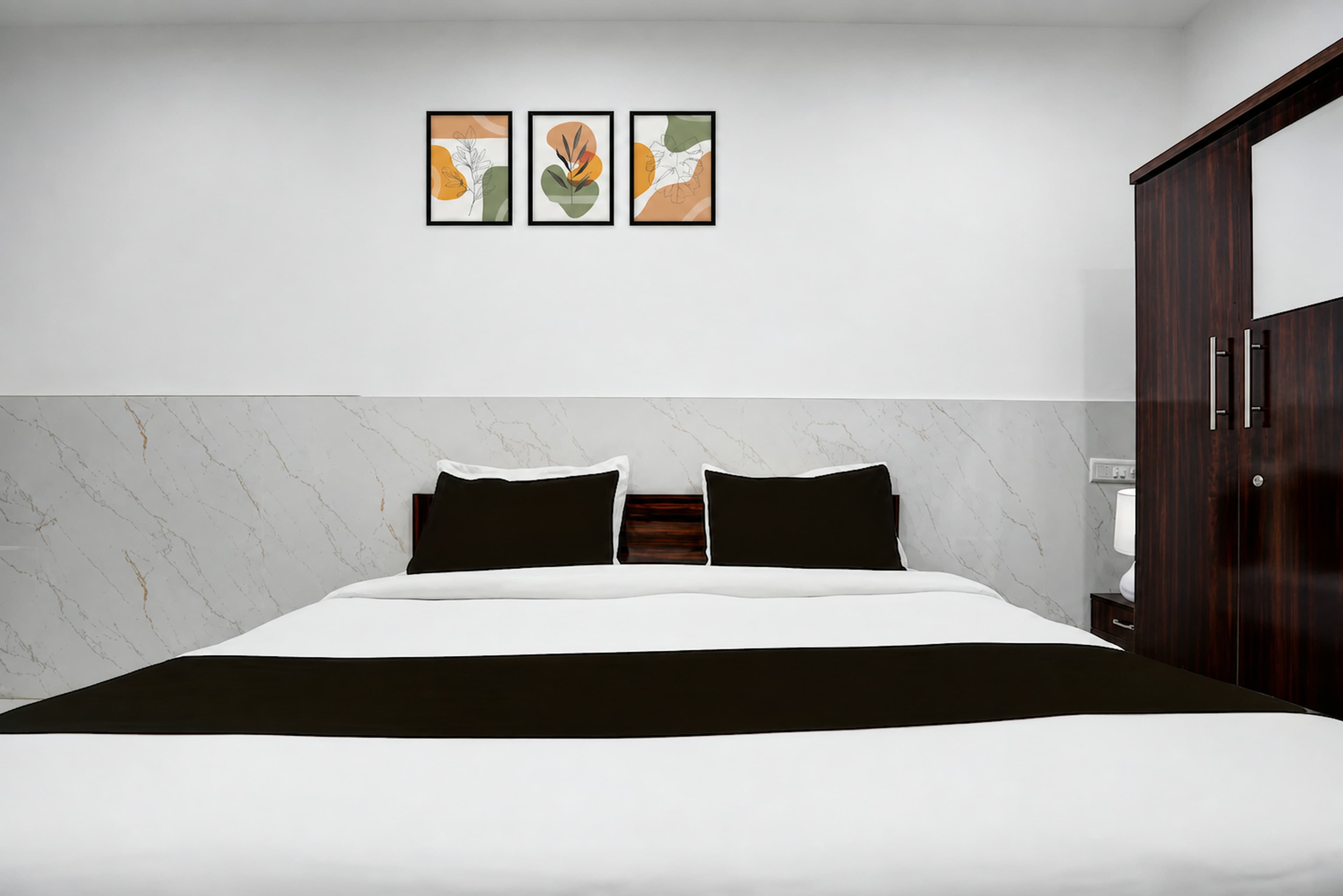 Guest room with a double bed and natural light
