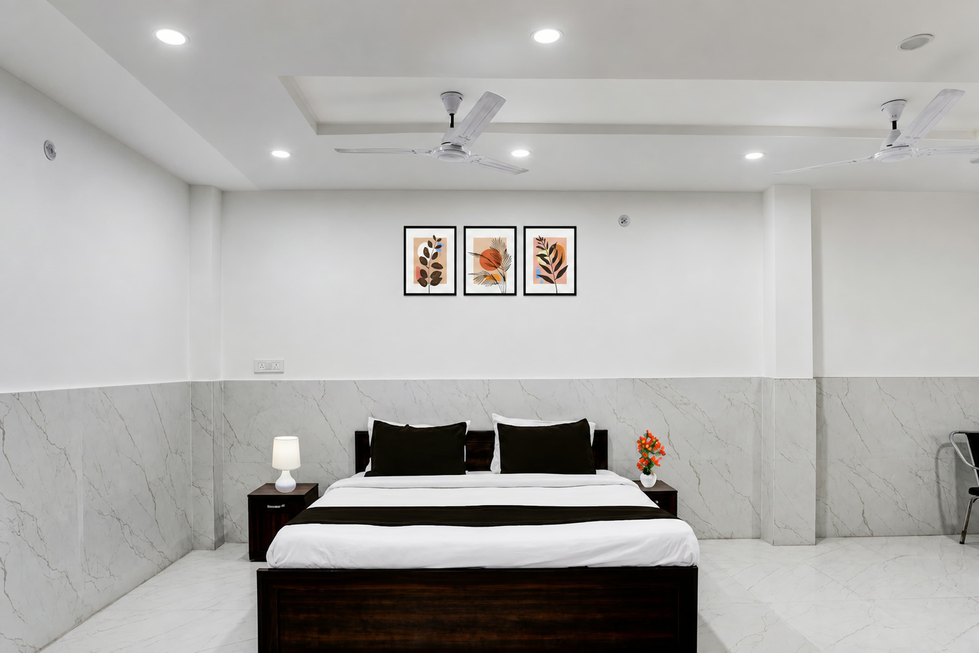 Guest room with a double bed and wall-mounted TV