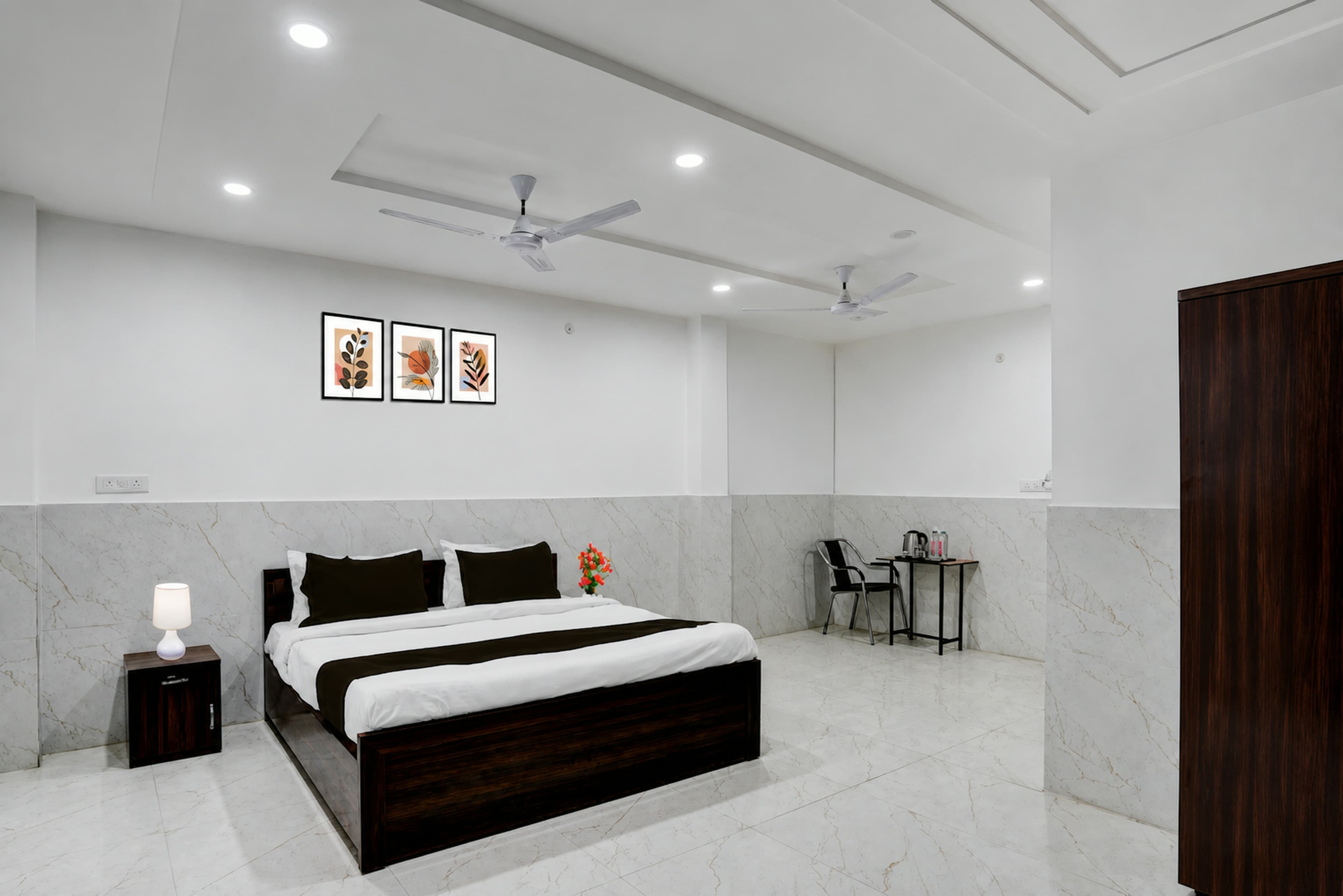 Guest room with a made-up bed and tiled flooring