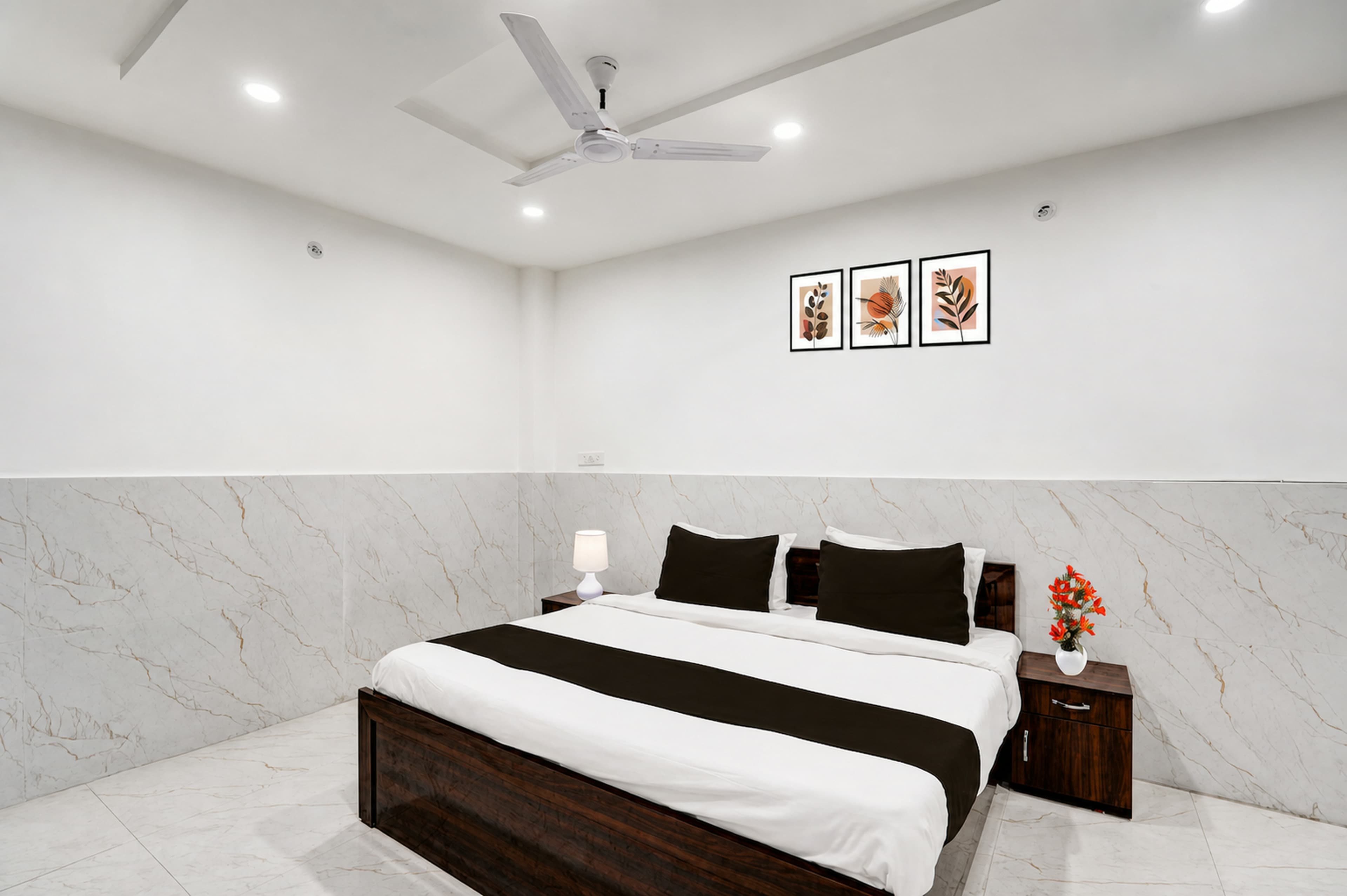 Guest room with a made-up bed and wardrobe