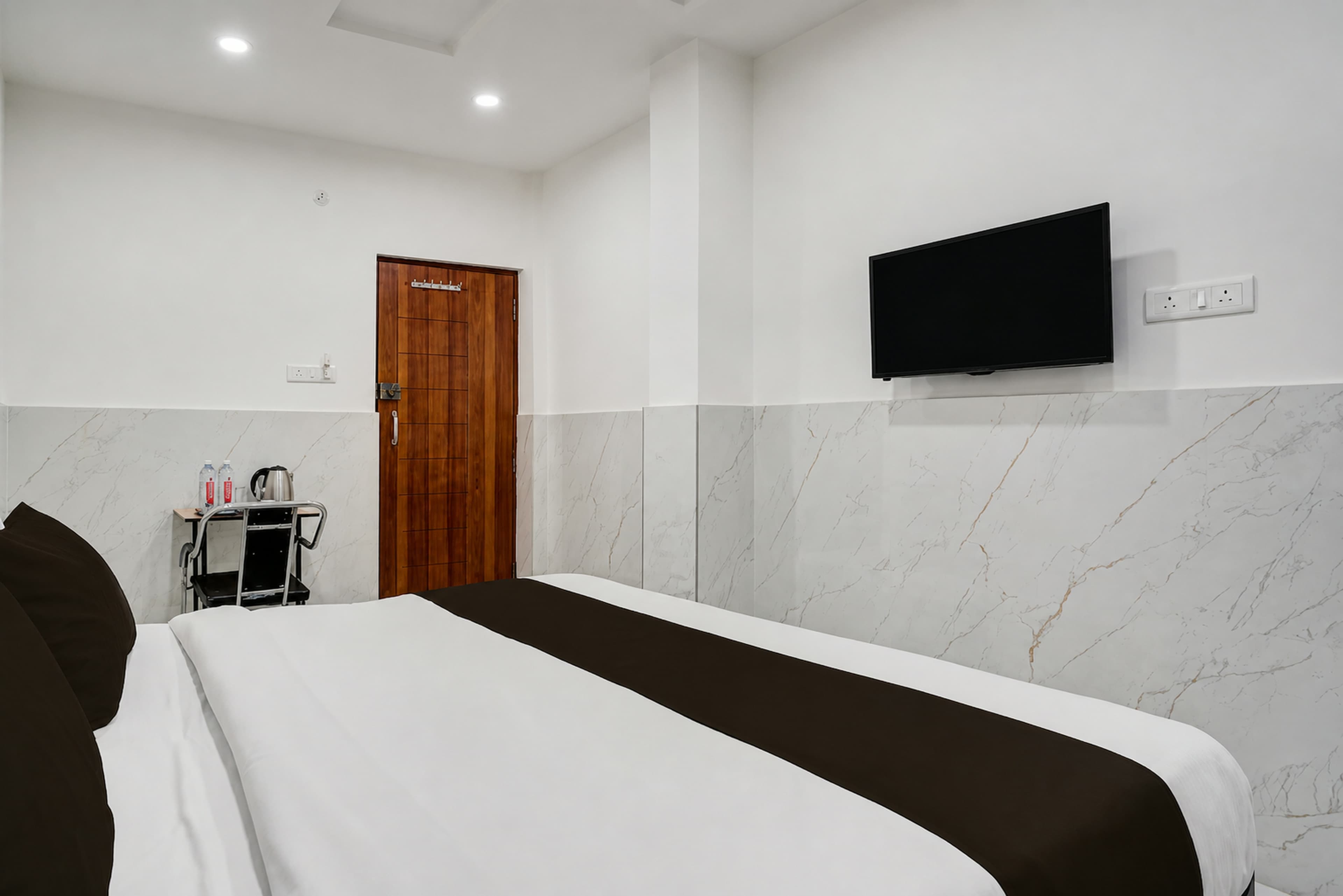 Guest room with a double bed and bedside table